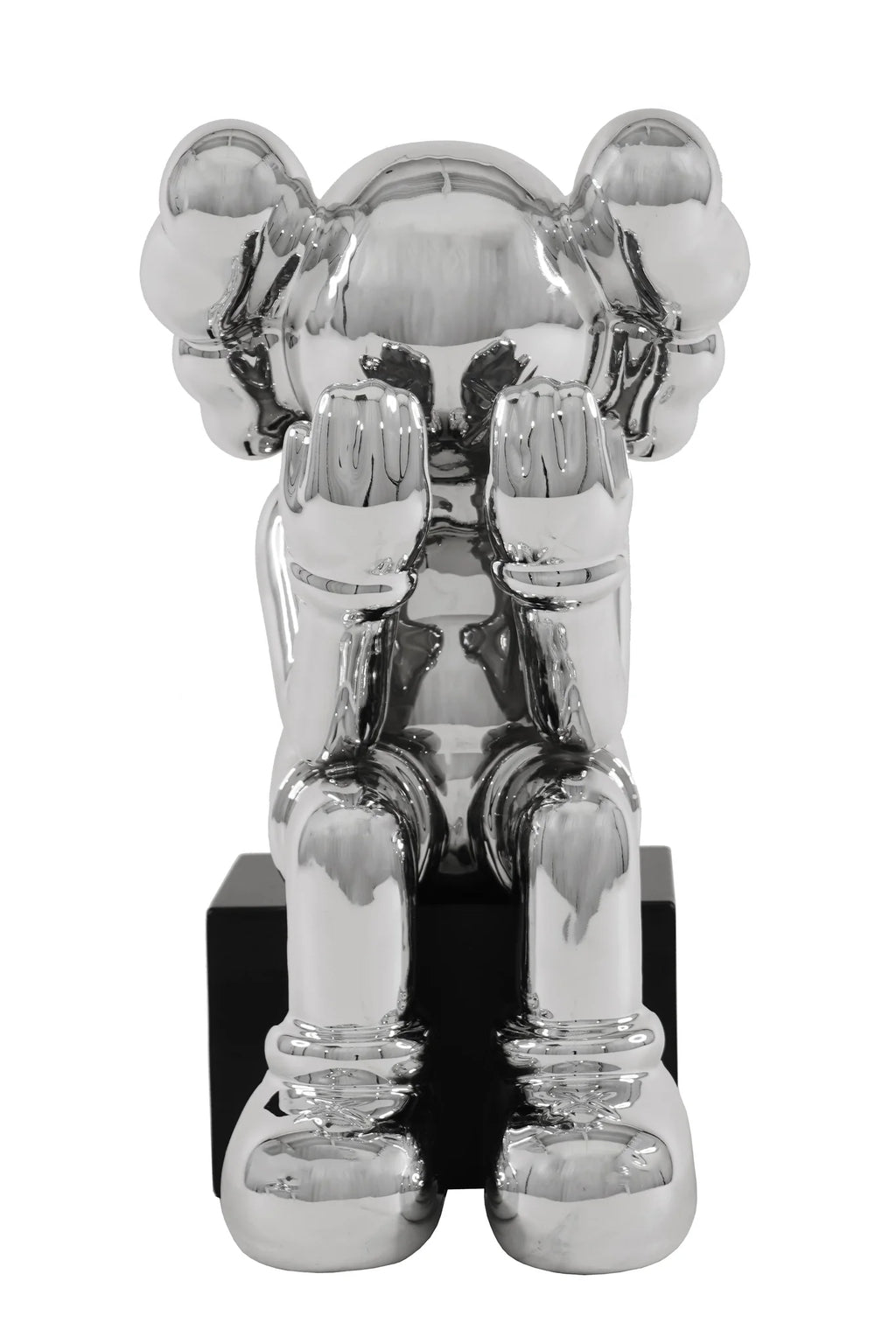 Escultura de payaso sentado